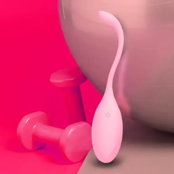œuf vibrant clitoridien contrôlé par téléphone posé à côté de 2 petites haltères roses